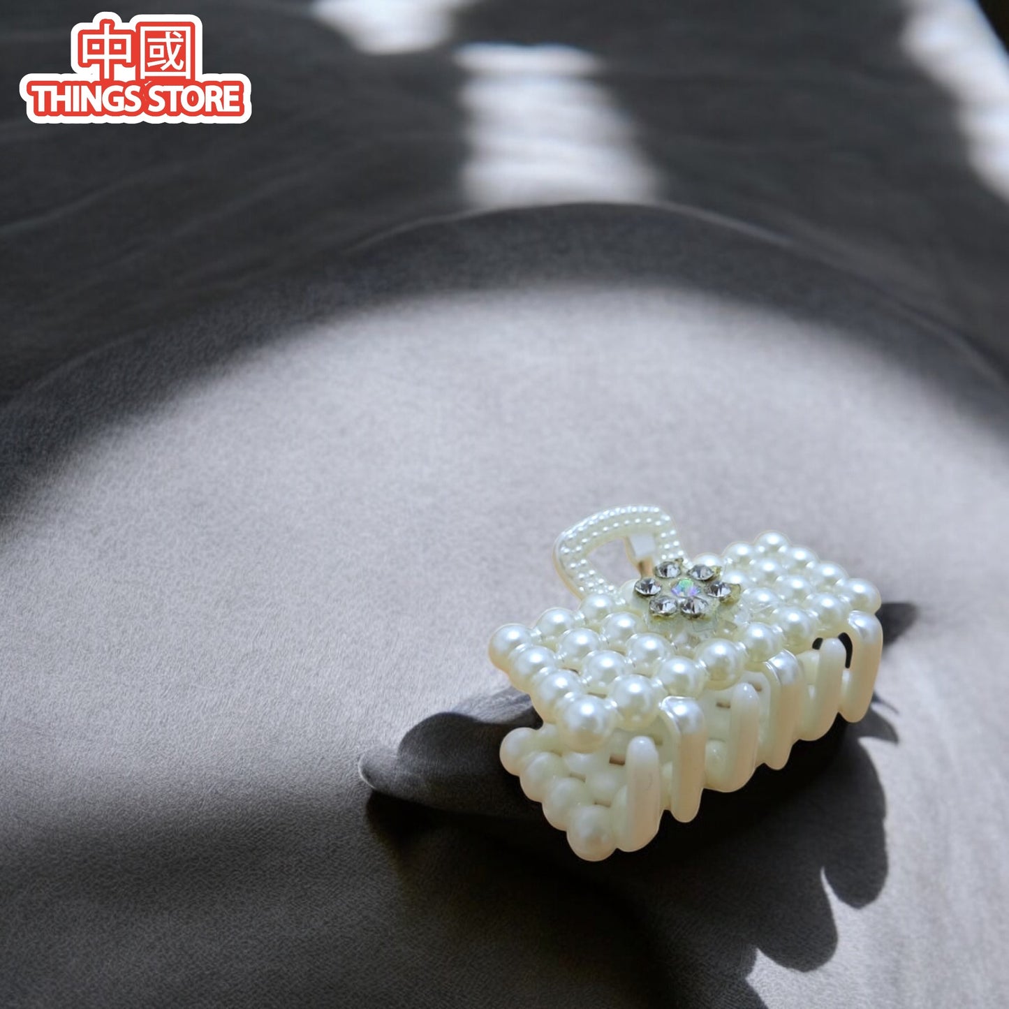 Pinza chica de perlas