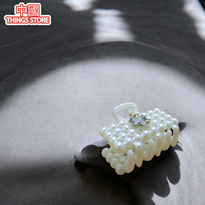 Pinza chica de perlas