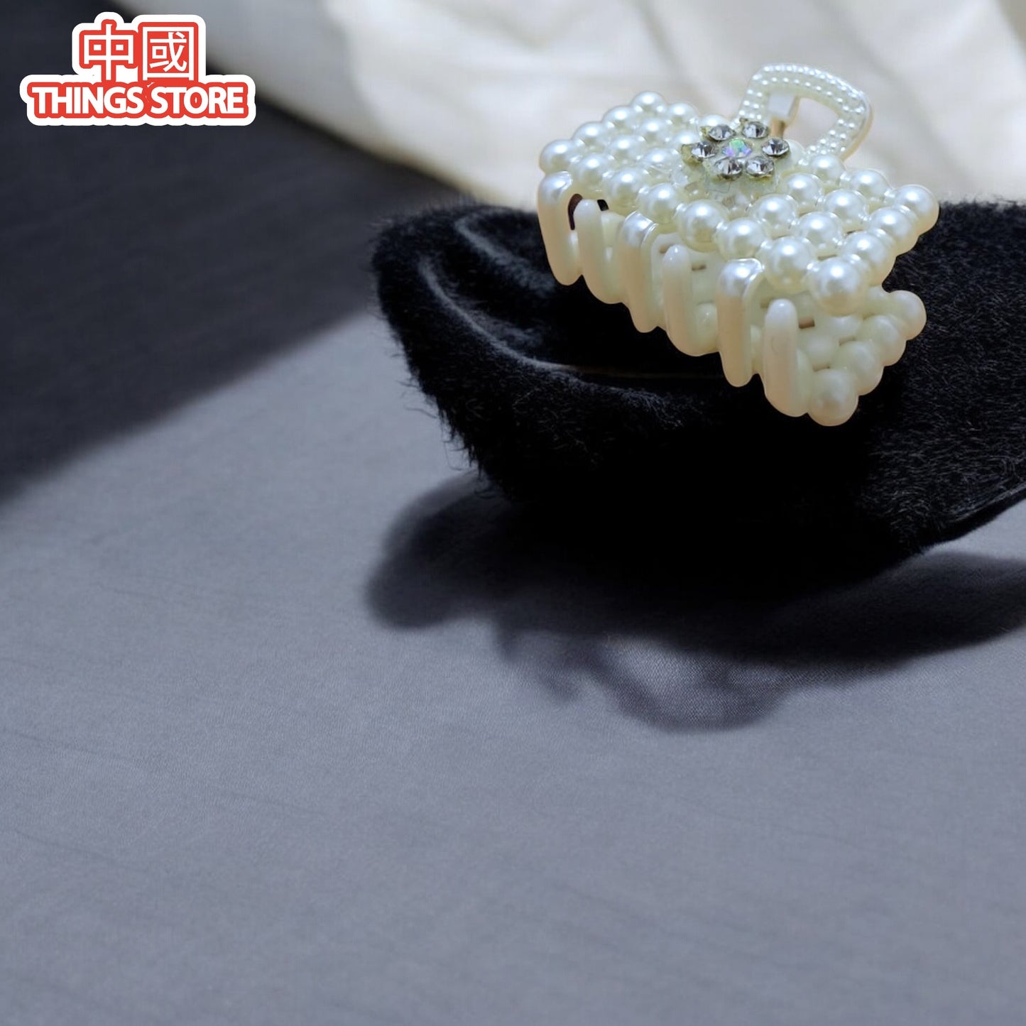 Pinza chica de perlas