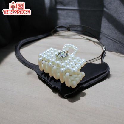 Pinza chica de perlas